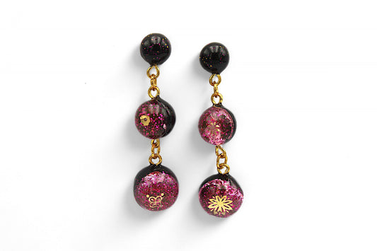 Sphère noire et paillettes